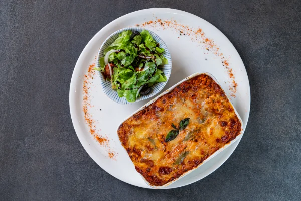 Chicken Lasagna with tender chicken in tomato sauce and mascarpone béchamel, served at The Meet Up in Cascavelle, Mauritius.
