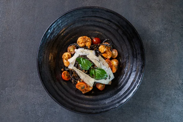 Spaghetti with Cuttlefish Ink featuring squid ink pasta, fresh seafood and authentic Italian flavours, served at The Meet Up in Cascavelle, Mauritius.