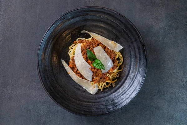 Traditional Spaghetti alla Bolognese with slow-cooked meat sauce, tomato, Parmesan cheese and authentic Italian flavours, served at The Meet Up in Cascavelle, Mauritius.