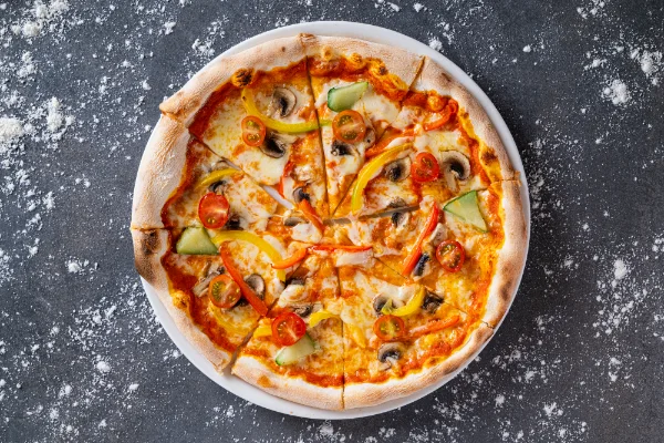 Freshly baked 4 Seasons Pizza with four classic topping sections, mozzarella and authentic Italian flavours, served at The Meet Up in Cascavelle, Mauritius.