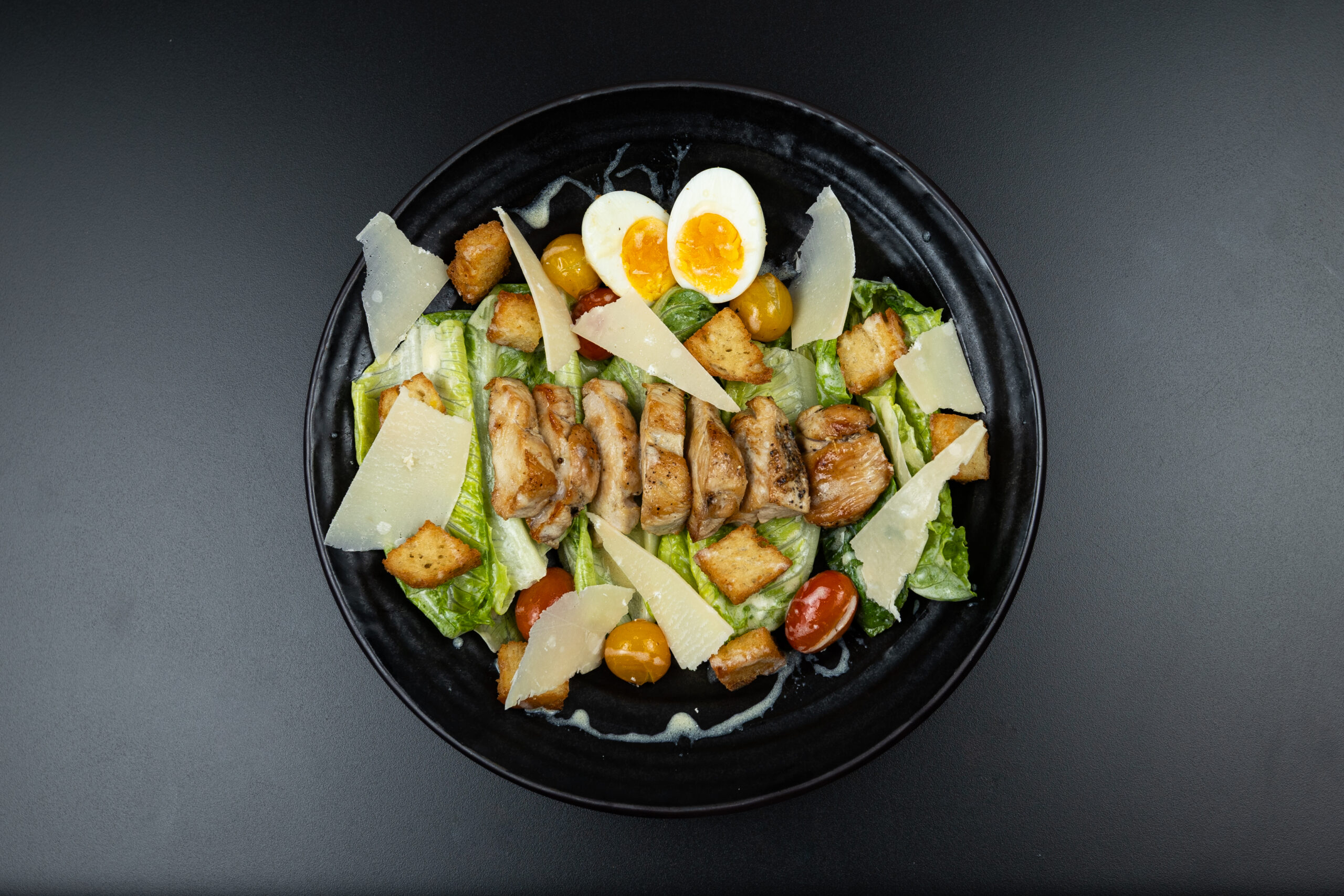 Fresh Caesar Salad with crisp lettuce, Parmesan cheese, crunchy croutons and creamy Caesar dressing served at The Meet Up in Cascavelle, Mauritius.