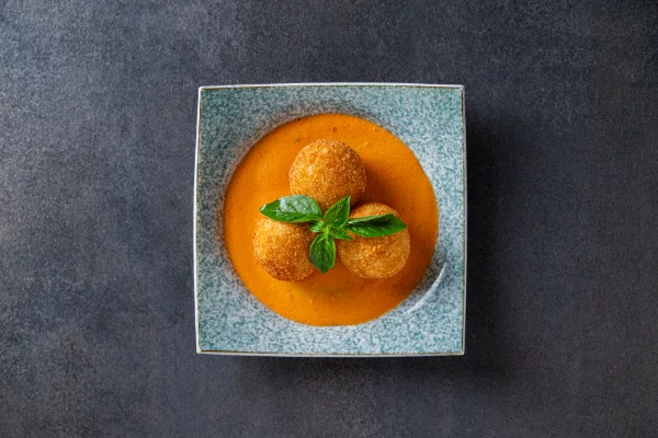 Crispy Arancini with golden fried Italian rice balls, melted cheese and authentic Italian flavours, served at The Meet Up in Cascavelle, Mauritius.