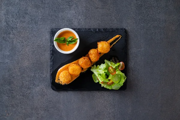 Crispy Mozzarella Balls with melted cheese and a golden breadcrumb coating, served at The Meet Up in Cascavelle, Mauritius.