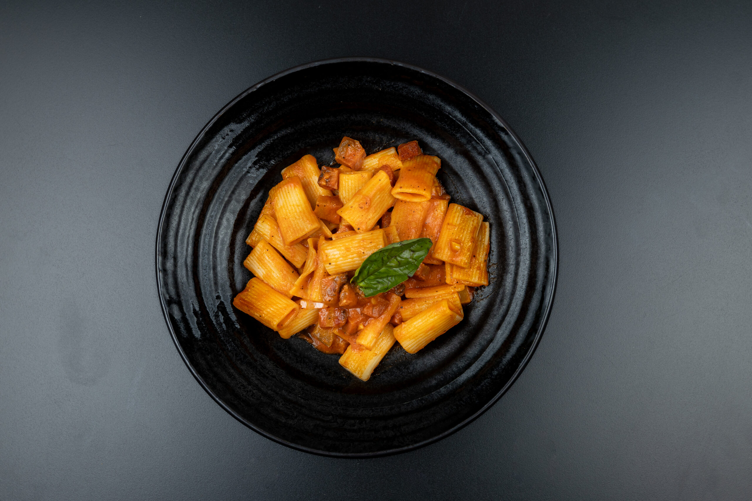 Authentic Rigatoni Amatriciana with rich tomato sauce, guanciale and Pecorino cheese served at The Meet Up in Cascavelle, Mauritius.