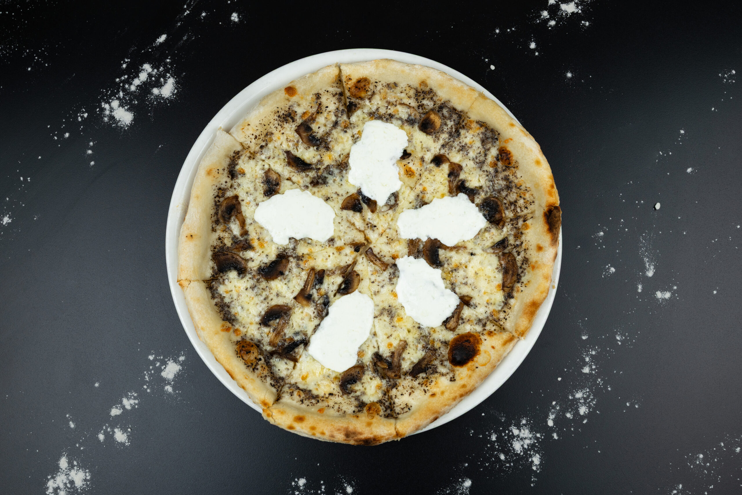 Freshly baked Truffle Pizza with mozzarella and rich truffle flavours, served at The Meet Up in Cascavelle, Mauritius.