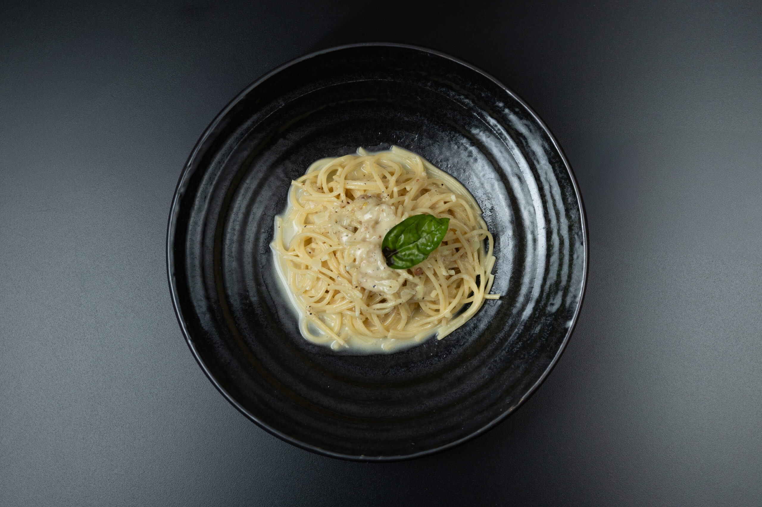 Creamy Spaghetti Cacio e Pepe with Pecorino Romano cheese and freshly cracked black pepper served at The Meet Up in Cascavelle, Mauritius.