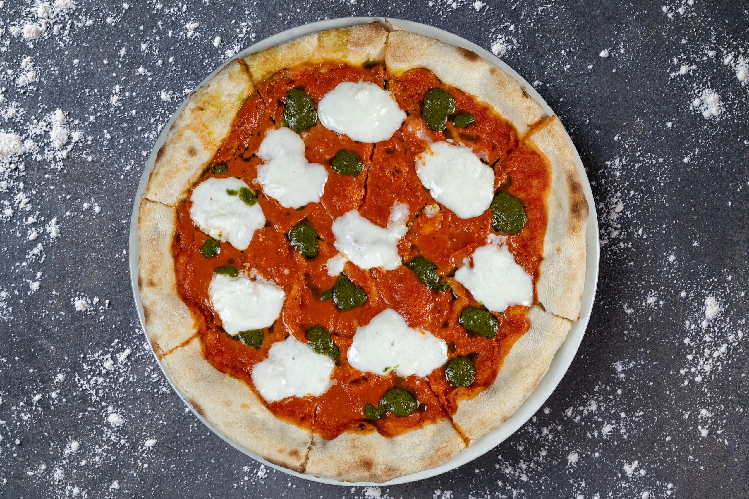 Fresh Pizza Caprese with mozzarella, tomato and basil served at The Meet Up in Cascavelle, Mauritius.